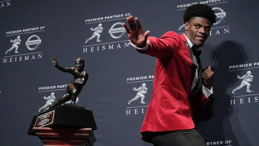 Lamar Jackson QB Louisville Heisman”
 class=